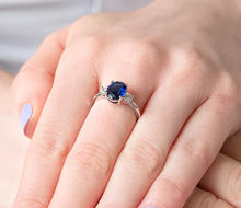 Load image into Gallery viewer, Diamond Style London - Oval cut blue ring with clear side stones in rhodi (Item code: Bluering6)
