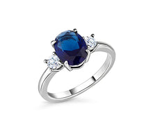 Load image into Gallery viewer, Diamond Style London - Oval cut blue ring with clear side stones in rhodi (Item code: Bluering6)